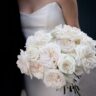 Elegant Bride with White Rose Bouquet in Modern Architectural Setting. This bride adorned her bouquet with an exquisite collection of garden roses.