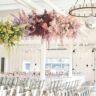 Rainbow-themed wedding ceremony with colorful decorations at 14 TENN Venue in Nashville.